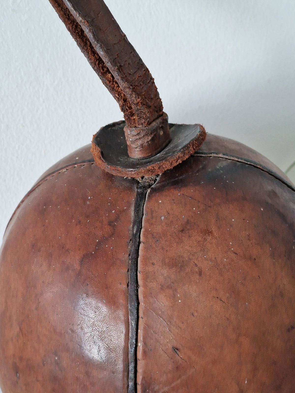 Vintage fitness ball with leather straps