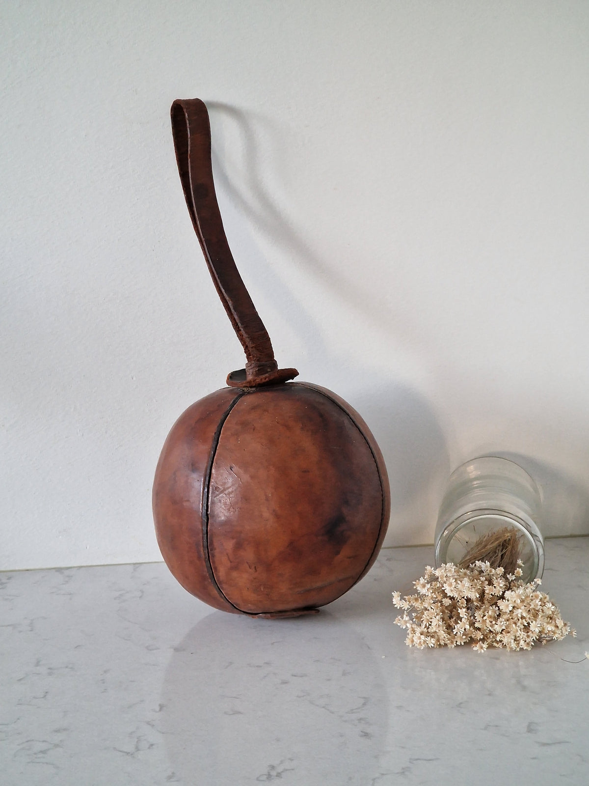 Vintage fitness ball with leather straps