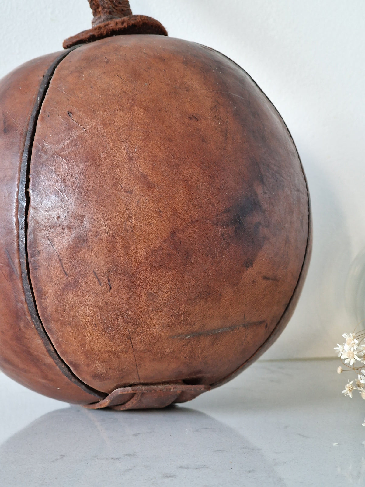 Vintage fitness ball with leather straps
