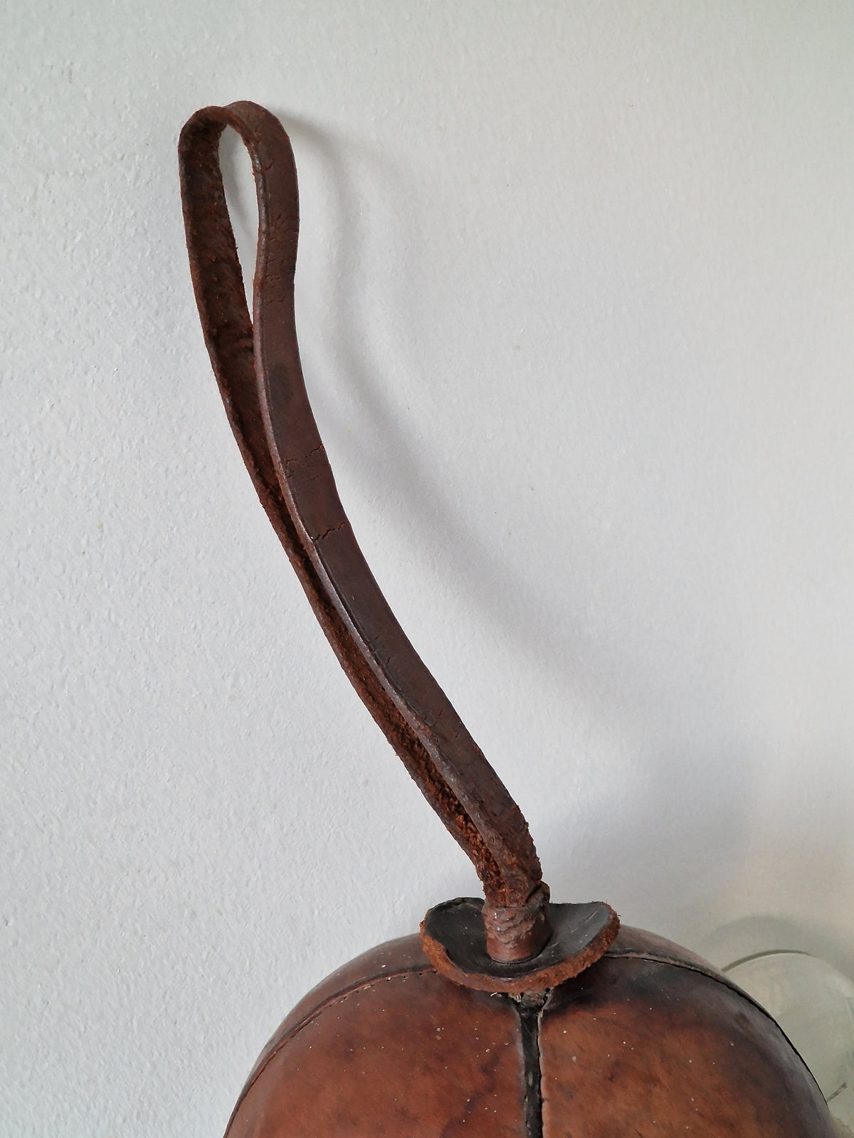 Vintage fitness ball with leather straps