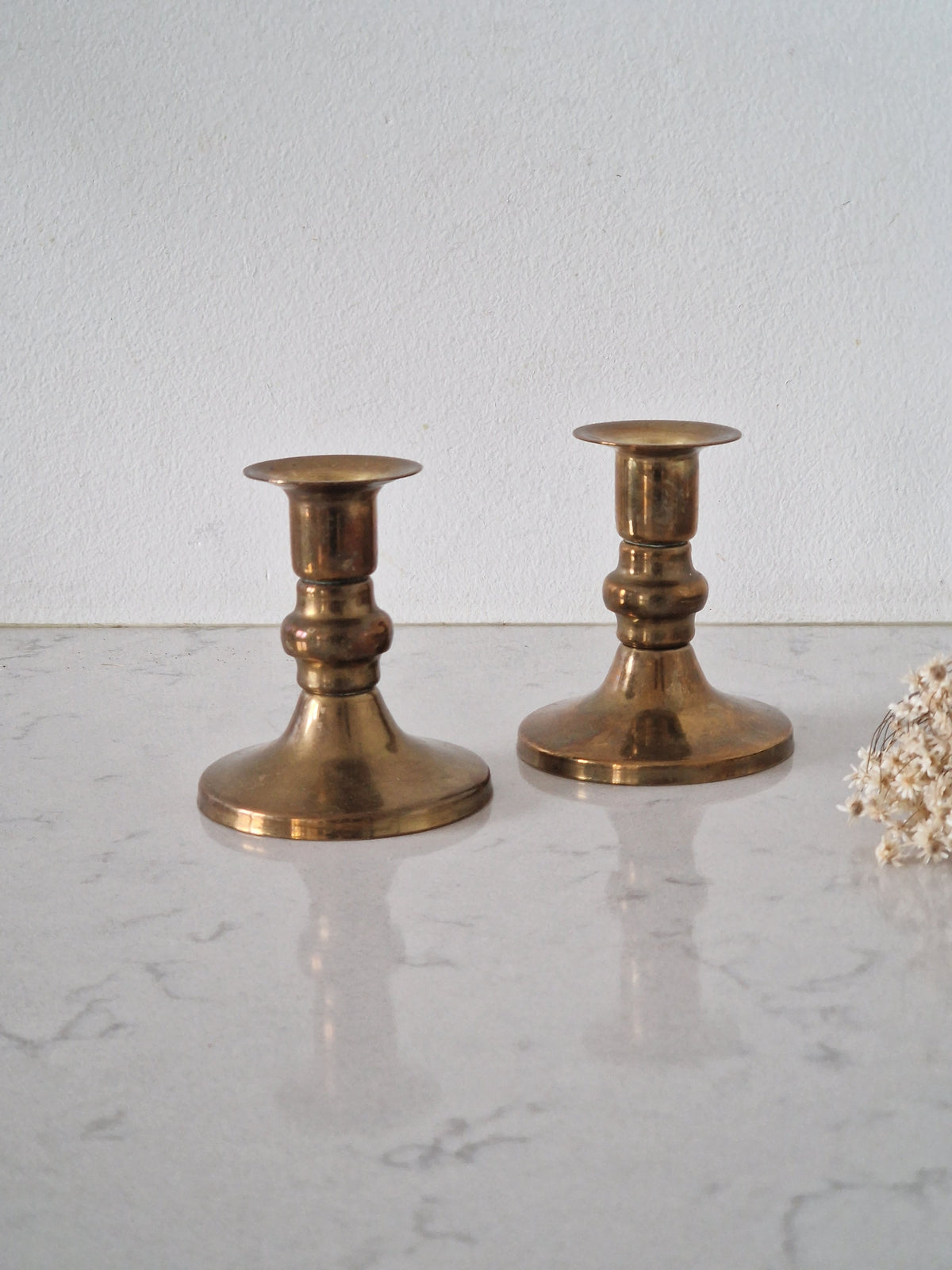 A pair of brass candlesticks