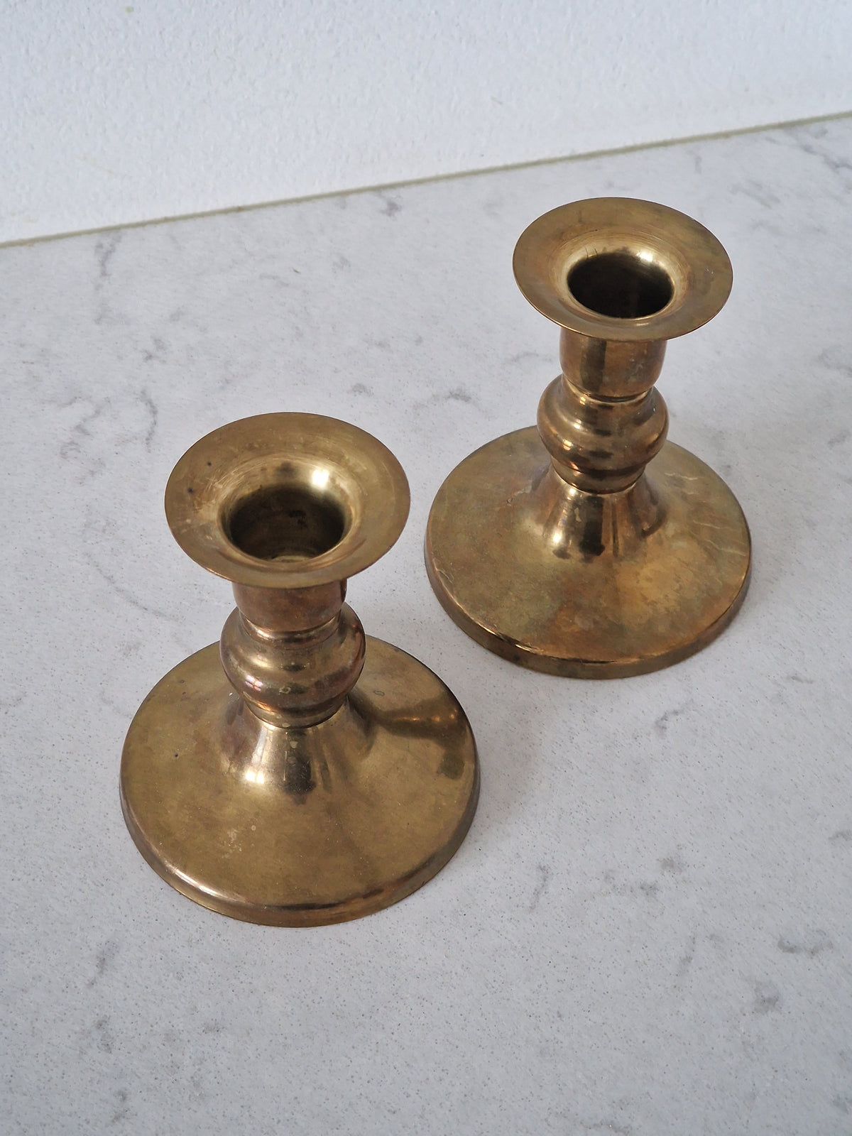 A pair of brass candlesticks