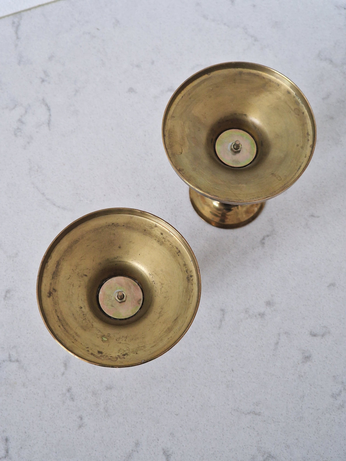 A pair of brass candlesticks
